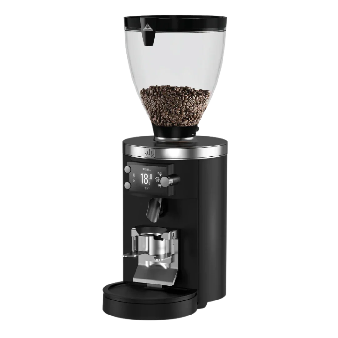 Black coffee grinder with clear container filled with coffee beans on a white background